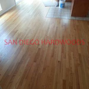 Solid oak flooring refinished with natural stain and 2 coats of water-based poly